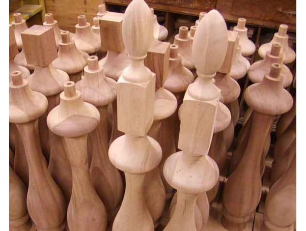 Group of many turned balusters. Two are shown with finial on top and all others with tenon only.